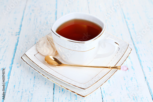 Photo: Cup of tea on table close-up Cup of tea on table close-up