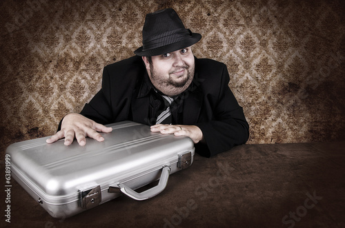 Photo: Business man and his suitcase Business man and his suitcase
