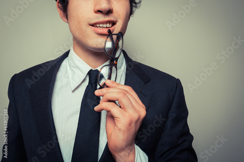 Photo: Thoughtful businessman with glasses Thoughtful businessman with glasses