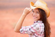 Cowgirl woman smiling happy on american prairie Cowgirl woman smiling happy on american prairie