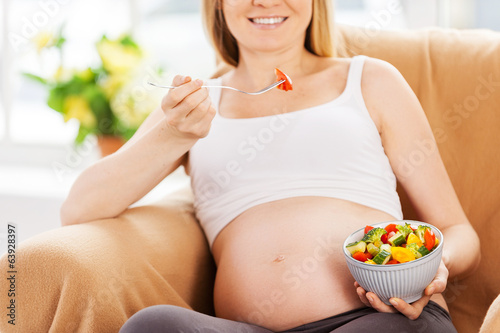 Photo: Eating fresh salad. Eating fresh salad.