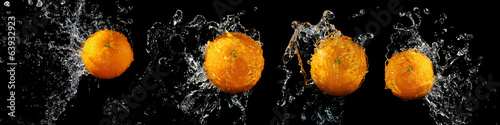  Set of fresh oranges in water splash