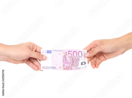 Photo: Two hands and 500 euro banknote. Two hands and 500 euro banknote.