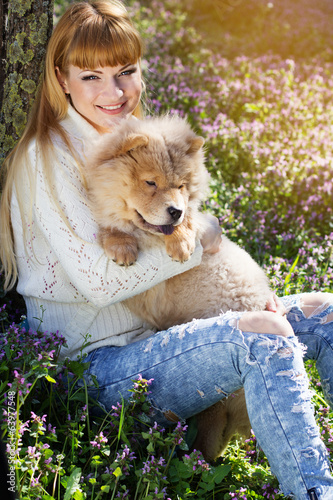 Photo: Portrait of a woman with her dog outdoors Portrait of a woman with her dog outdoors
