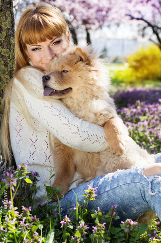 Photo: Portrait of a woman with her dog outdoors Portrait of a woman with her dog outdoors
