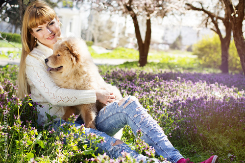 Photo: Portrait of a woman with her dog outdoors Portrait of a woman with her dog outdoors