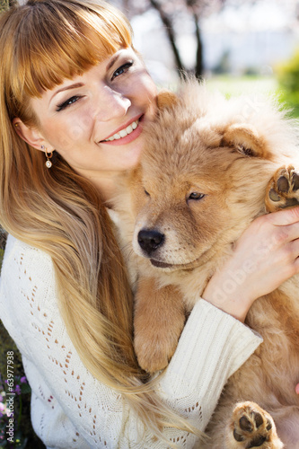 Photo: Portrait of a woman with her dog outdoors Portrait of a woman with her dog outdoors