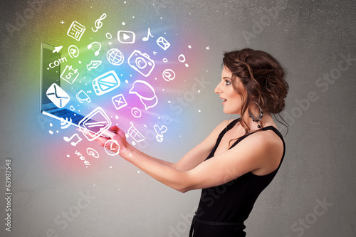 Photo: Young lady holding notebook with colorful hand drawn multimedia Young lady holding notebook with colorful hand drawn multimedia