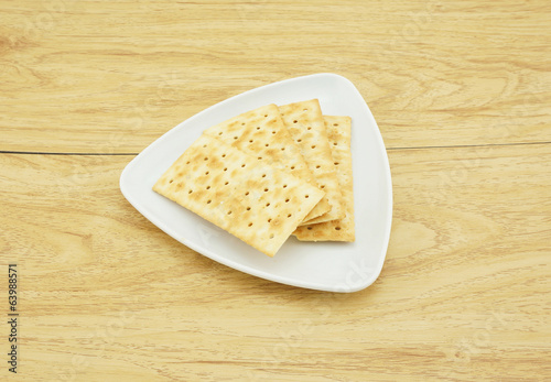 Photo: Square crackers in a white plate Square crackers in a white plate