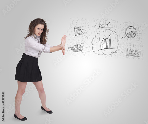 Photo: Business girl presenting hand drawn sketch graphs and charts Business girl presenting hand drawn sketch graphs and charts