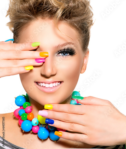 Photo: Beauty Girl with Colorful Makeup, Nail polish and Accessories Beauty Girl with Colorful Makeup, Nail polish and Accessories