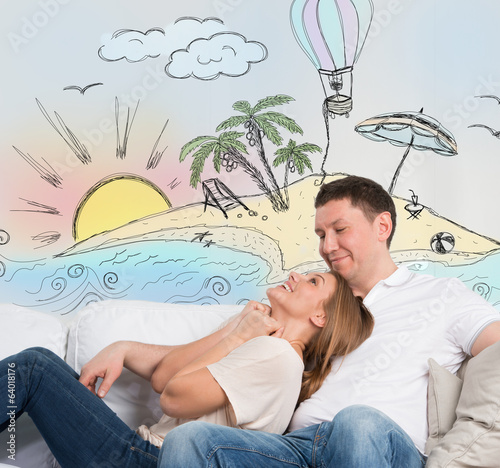 Photo: Couple planning summer holidays vacation Couple planning summer holidays vacation