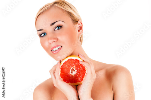 Photo: beautiful healthy woman with half a grapefruit in hands beautiful healthy woman with half a grapefruit in hands