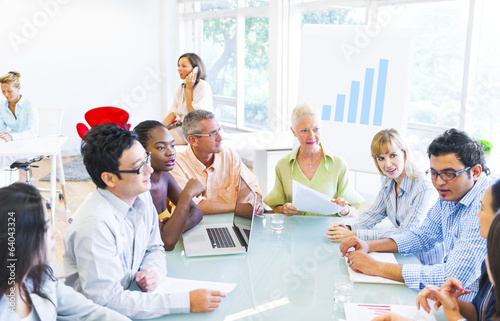 Photo: Group of Business People Having a Meeting Group of Business People Having a Meeting