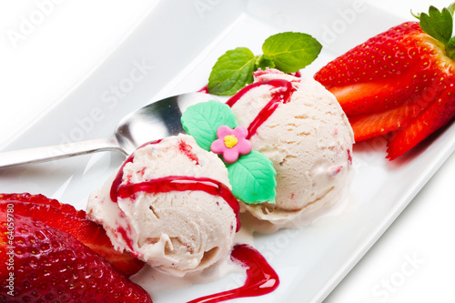 Photo: Strawberry ice cream with fruits close up Strawberry ice cream with fruits close up