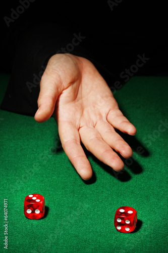 Photo: Playing dices on green table Playing dices on green table