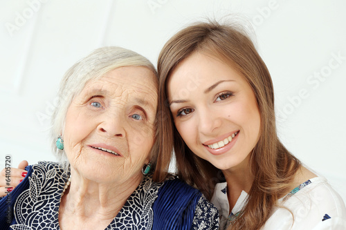 Photo: Elderly woman with granddaughter Elderly woman with granddaughter