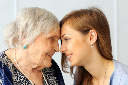 Photo: Elderly woman with granddaughter Elderly woman with granddaughter
