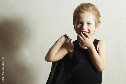 Photo: funny little boy.fashion children.handsome smiling kid funny little boy.fashion children.handsome smiling kid