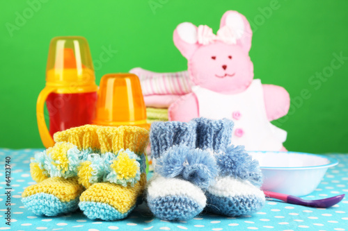 Photo: Composition with crocheted booties for baby, clothes and other Composition with crocheted booties for baby, clothes and other