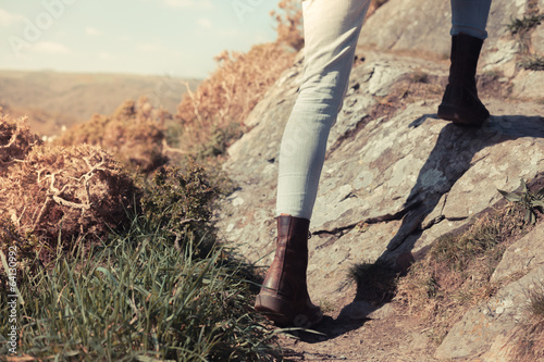 Photo: Young woman walking in the mountains Young woman walking in the mountains