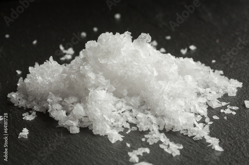 Photo: Maldon sea salt on black background Maldon sea salt on black background
