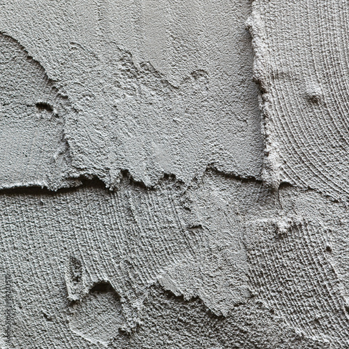 Photo: plasterer concrete worker at wall of house construction plasterer concrete worker at wall of house construction