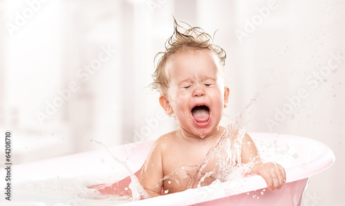 Photo: happy funny baby laughing and bathed in bath happy funny baby laughing and bathed in bath