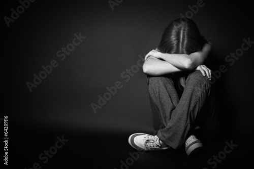 Photo: woman in depression and despair crying on black dark woman in depression and despair crying on black dark