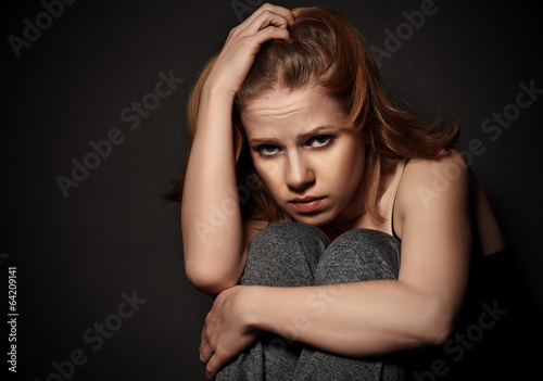 Photo: woman in depression and despair crying on black dark woman in depression and despair crying on black dark