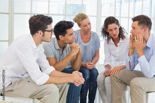 Photo: Group therapy in session sitting in a circle Group therapy in session sitting in a circle