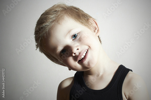 Photo: Smiling Child. Funny Little Boy. Handsome. Close-up portrait Smiling Child. Funny Little Boy. Handsome. Close-up portrait