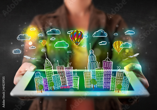 Photo: Young person showing tablet with hand drawn cityscape Young person showing tablet with hand drawn cityscape