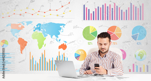 Photo: Business man with colorful charts Business man with colorful charts