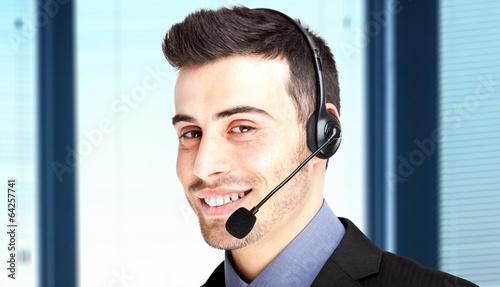 Photo: Smiling call center operator Smiling call center operator
