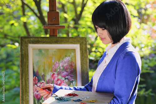 Photo: Beautiful girl painting oudoor Beautiful girl painting oudoor