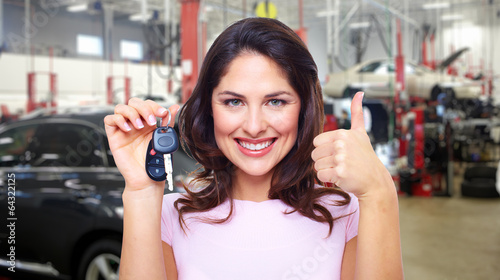 Photo: Beautiful woman with a car key. Beautiful woman with a car key.