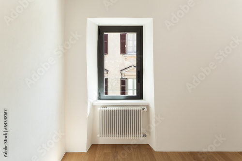 Photo: modern loft, empty room with window modern loft, empty room with window