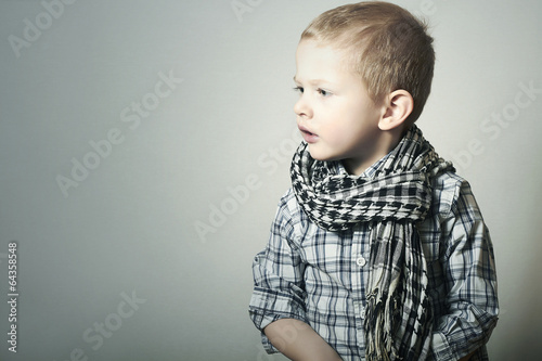 Photo: Child. Fashionable Funny little Boy in Scurf. Fashion Children Child. Fashionable Funny little Boy in Scurf. Fashion Children
