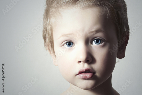 Photo: Child. Funny Little Boy. Handsome Boy with Blue Eyes Child. Funny Little Boy. Handsome Boy with Blue Eyes