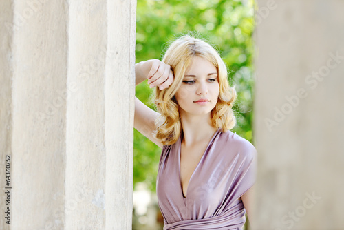 Photo: tender girl near the column tender girl near the column