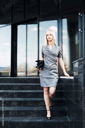 Photo: Young fashion business woman on the steps Young fashion business woman on the steps