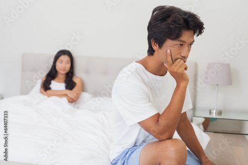 Photo: Couple not talking after argument in bed Couple not talking after argument in bed