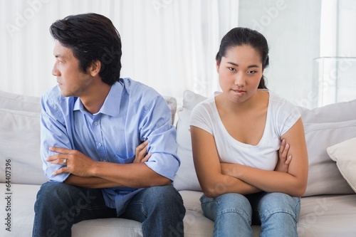 Photo: Couple not talking after a dispute on the sofa Couple not talking after a dispute on the sofa
