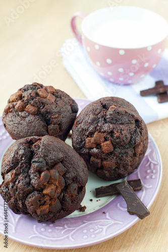 Photo: Homemade chocolate muffins with milk. Morning breakfast Homemade chocolate muffins with milk. Morning breakfast