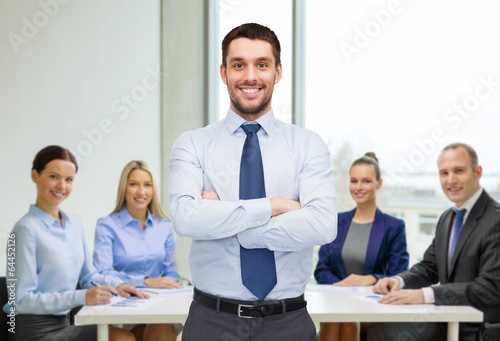 Photo: handsome businessman with crossed arms handsome businessman with crossed arms