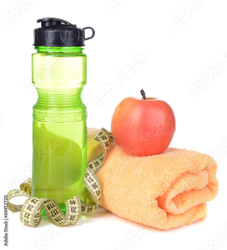 Photo: Sports bottle, apple,towel and measuring tape isolated on white Sports bottle, apple,towel and measuring tape isolated on white