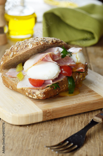 Photo: Bacon and poached eggs sandwich Bacon and poached eggs sandwich