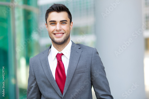 Photo: Very handsome businessman in an urban setting Very handsome businessman in an urban setting