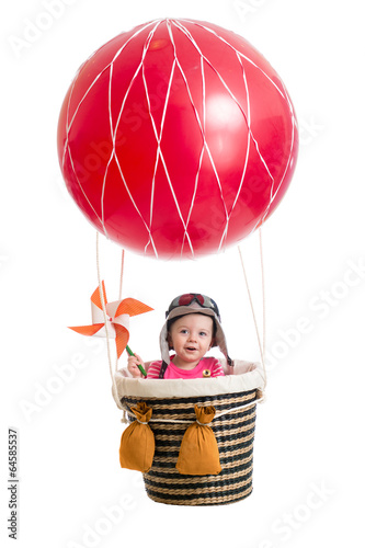 Photo: cheerful kid on hot air balloon cheerful kid on hot air balloon